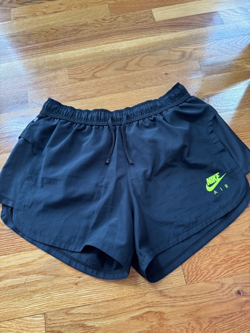 Nike Women's Black Athletic Shorts with Neon Green Logo